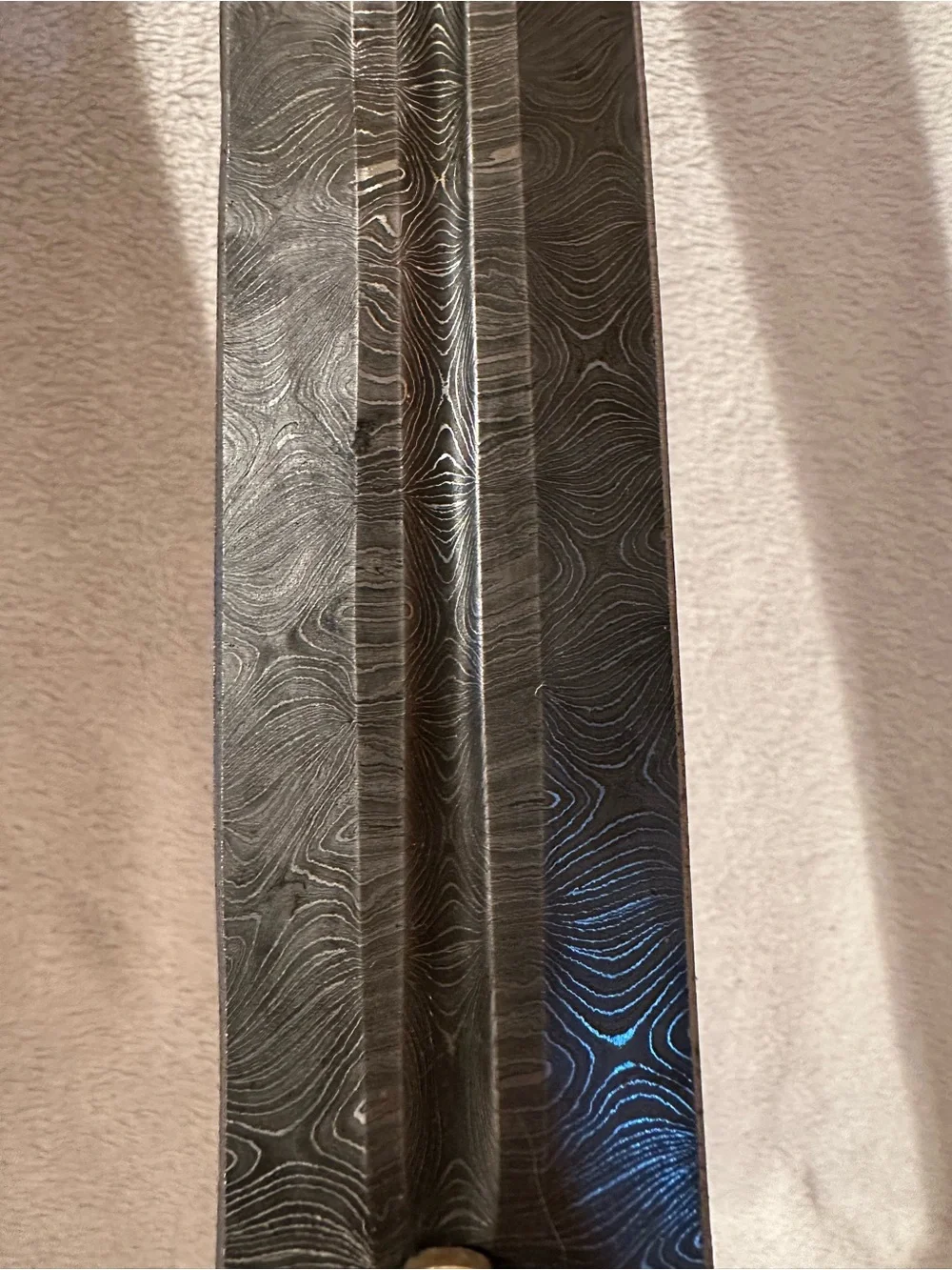 Damascus Rhindon Sword. Comes with yellow sheath.